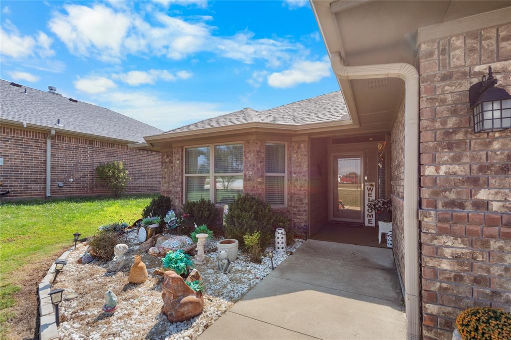3016 Loy Lake Road Denison, TX 75020 - Photo 27 of 28 a front view of a house with garden