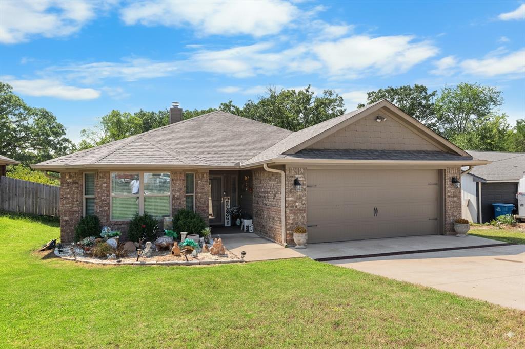 3016 Loy Lake Road Denison, TX 75020 - Photo 28 of 28 a front view of a house with porch and garden