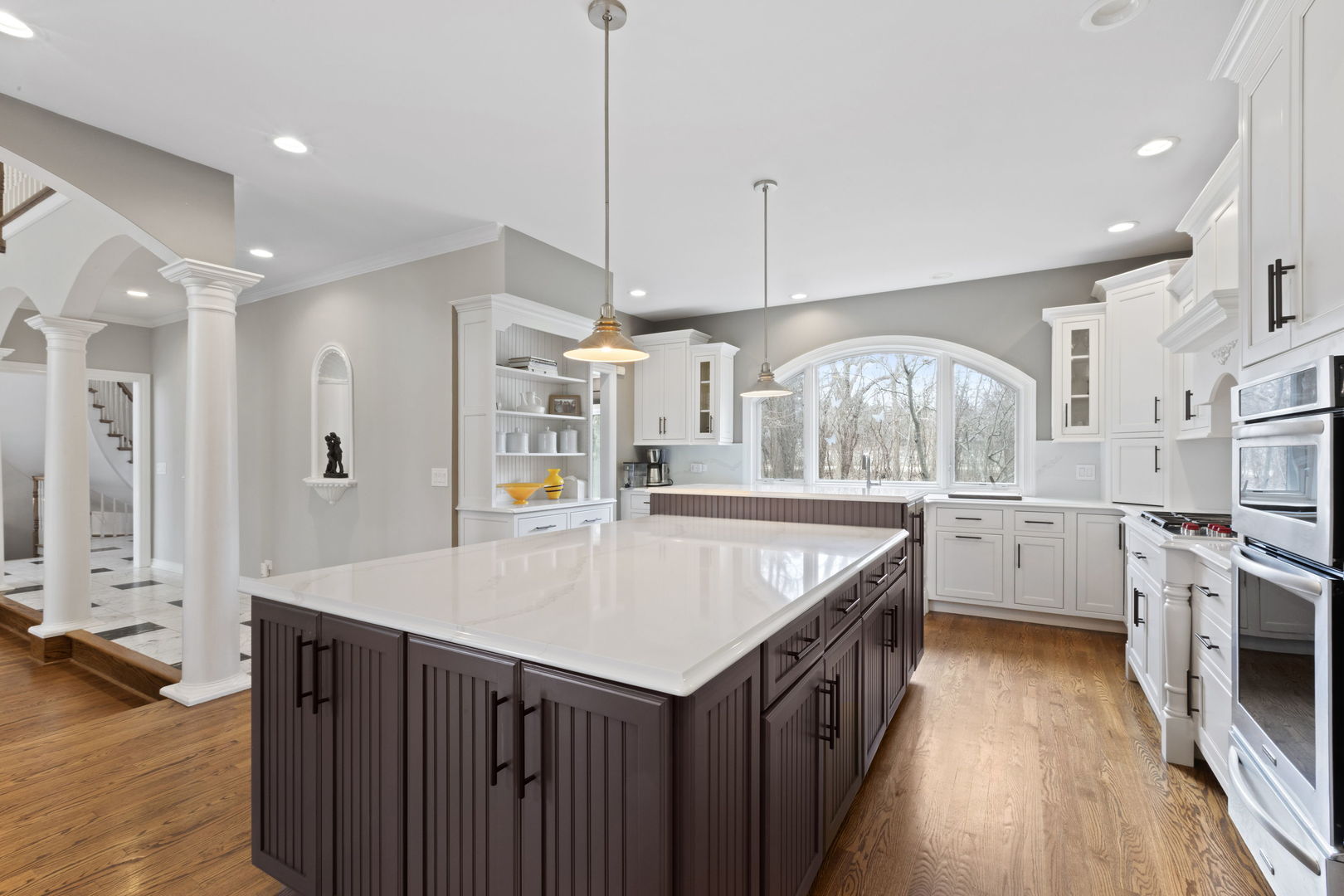 791 South Ridge Road Lake Forest, IL 60045 - Photo 11 of 40 a kitchen with a stove a refrigerator a oven a sink with island and chairs