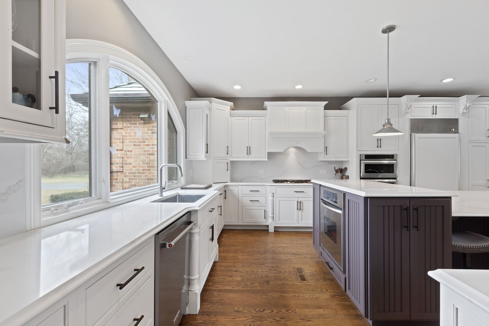 791 South Ridge Road Lake Forest, IL 60045 - Photo 12 of 40 a kitchen with a sink stove and cabinets