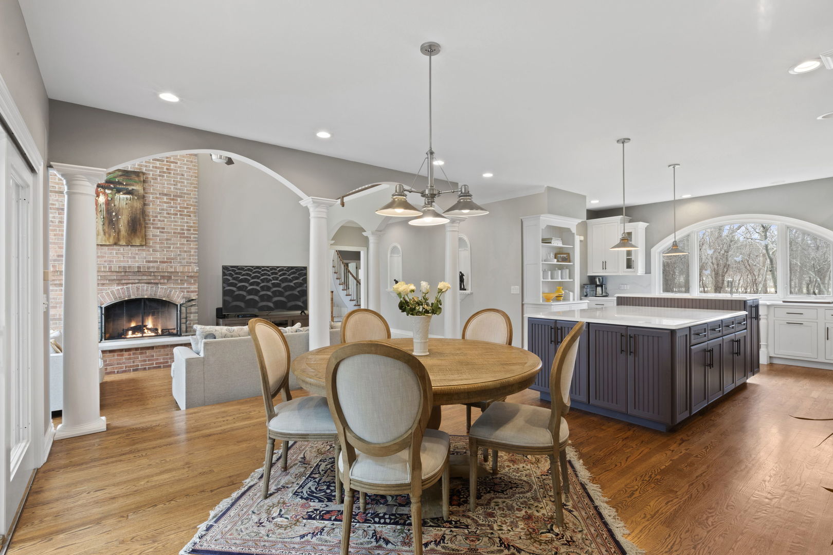 791 South Ridge Road Lake Forest, IL 60045 - Photo 13 of 40 a living room with furniture a fireplace and kitchen view