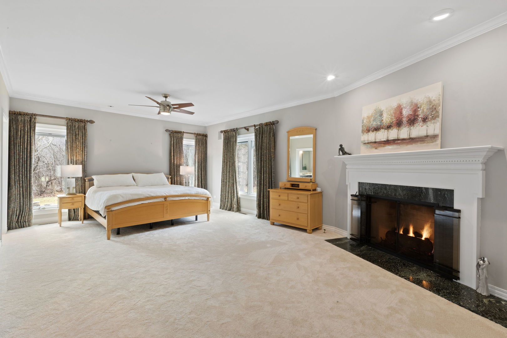 791 South Ridge Road Lake Forest, IL 60045 - Photo 17 of 40 a bedroom with a bed and a fireplace