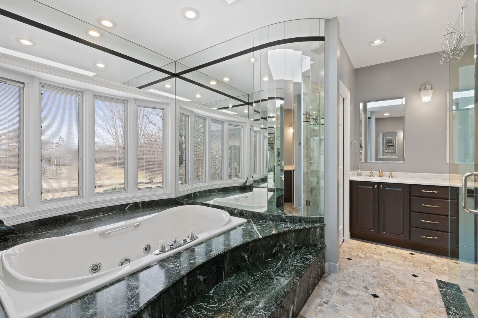 791 South Ridge Road Lake Forest, IL 60045 - Photo 20 of 40 a spacious bathroom with a granite countertop tub sink and mirror