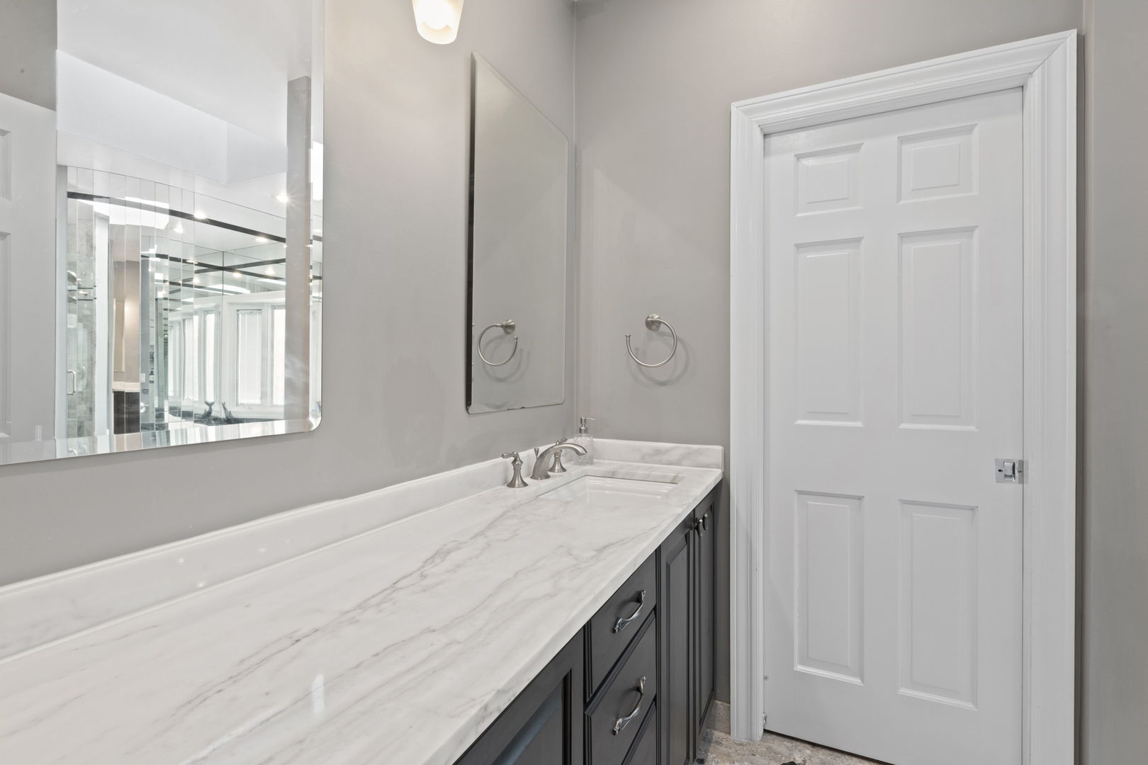791 South Ridge Road Lake Forest, IL 60045 - Photo 21 of 40 a bathroom with a granite countertop sink and a mirror