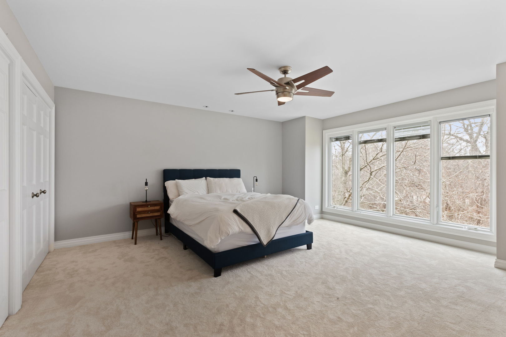 791 South Ridge Road Lake Forest, IL 60045 - Photo 24 of 40 a spacious bedroom with a large bed and a large window