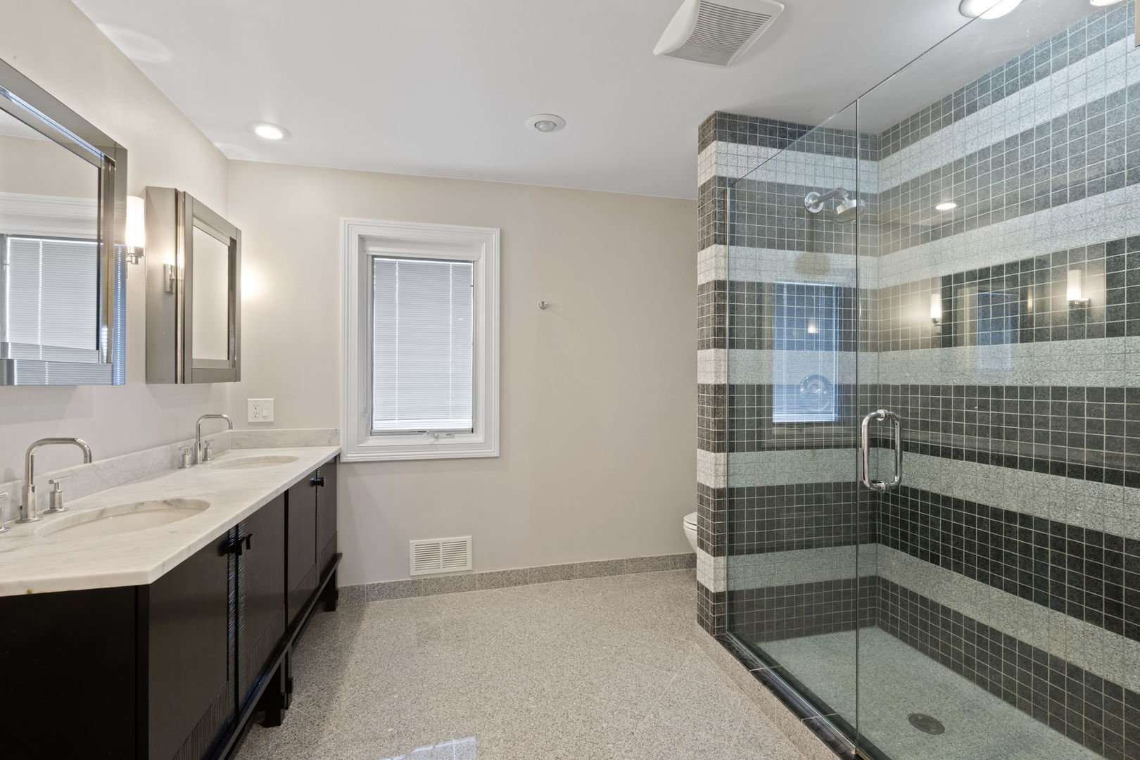 791 South Ridge Road Lake Forest, IL 60045 - Photo 27 of 40 a bathroom with a shower sink and mirror
