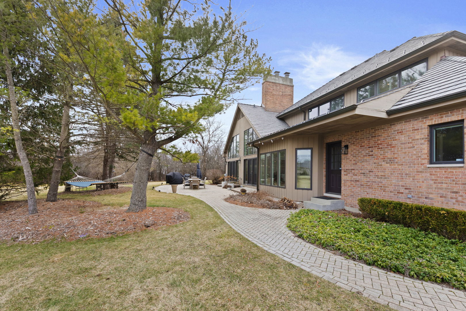 791 South Ridge Road Lake Forest, IL 60045 - Photo 32 of 40 a front view of a house with a yard garage and outdoor seating