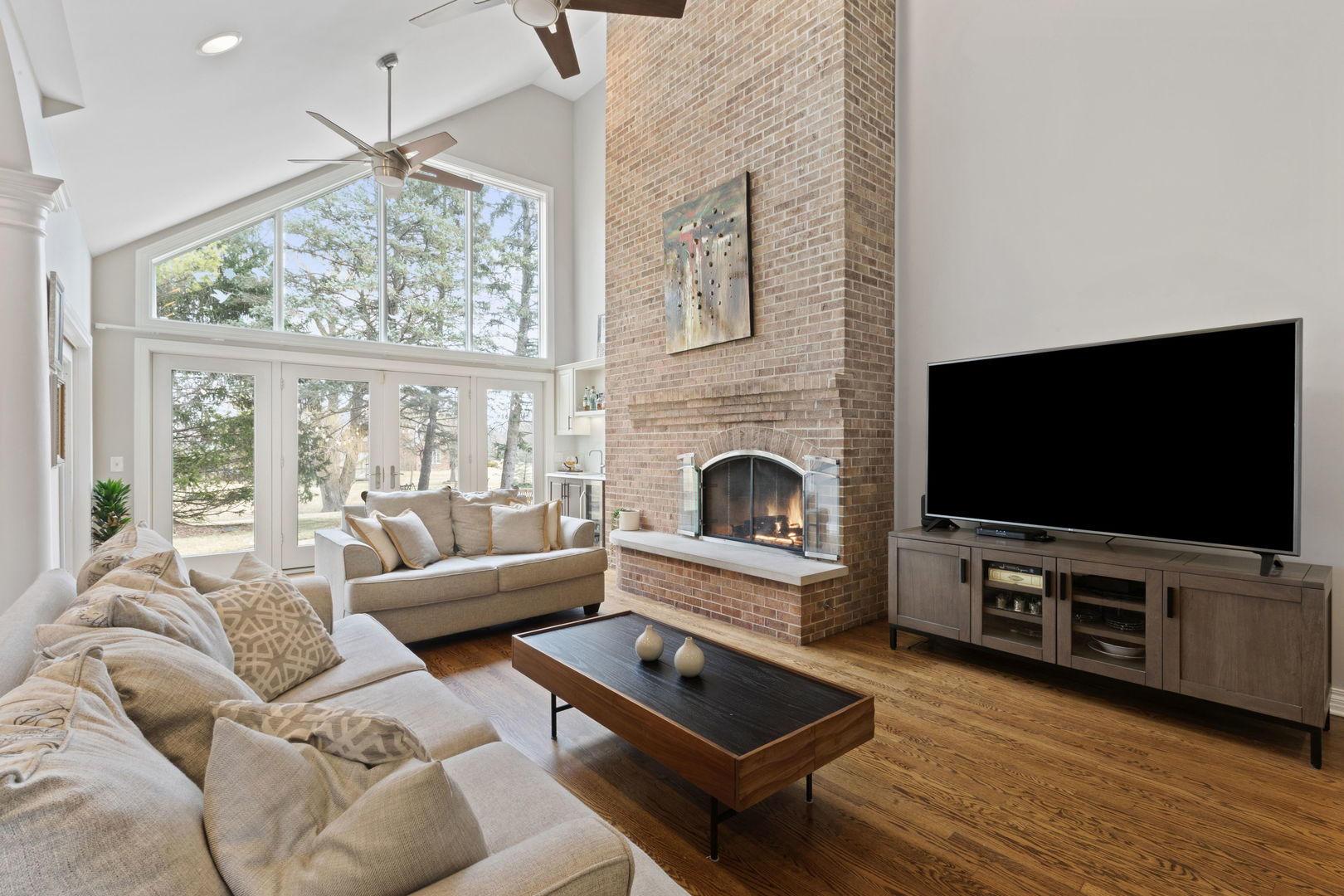 791 South Ridge Road Lake Forest, IL 60045 - Photo 9 of 40 a living room with furniture a flat screen tv and a fireplace