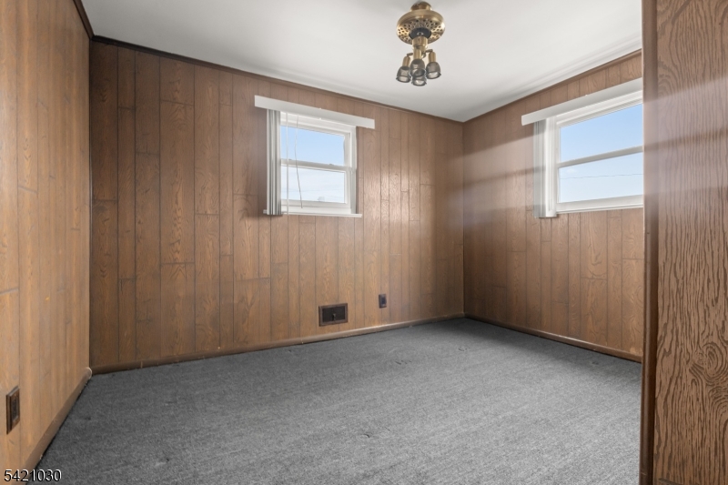838 Florida Grove Road Perth Amboy, NJ 08861 - Photo 11 of 13 an empty room with windows