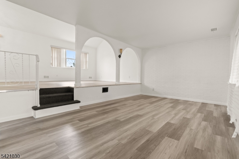 838 Florida Grove Road Perth Amboy, NJ 08861 - Photo 2 of 13 a view of a livingroom with wooden floor