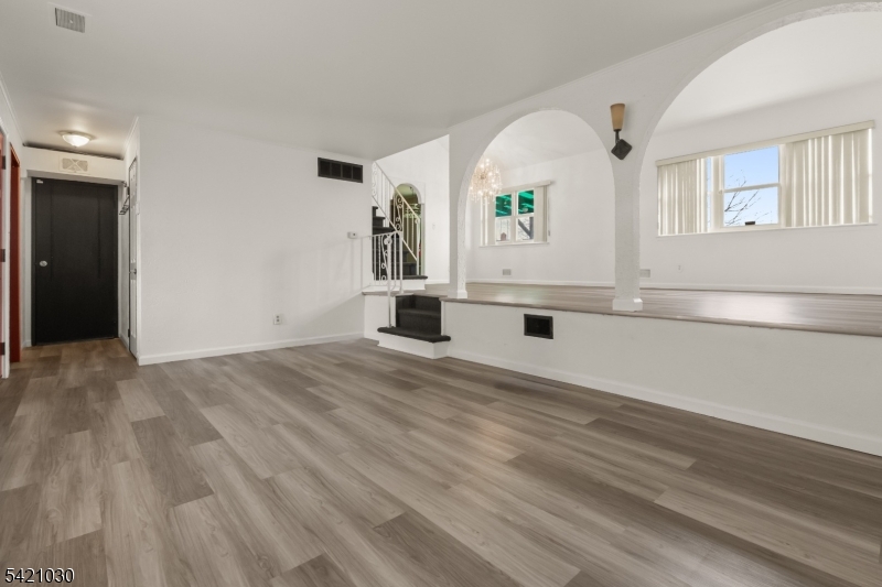 838 Florida Grove Road Perth Amboy, NJ 08861 - Photo 3 of 13 an empty room with window and mirror