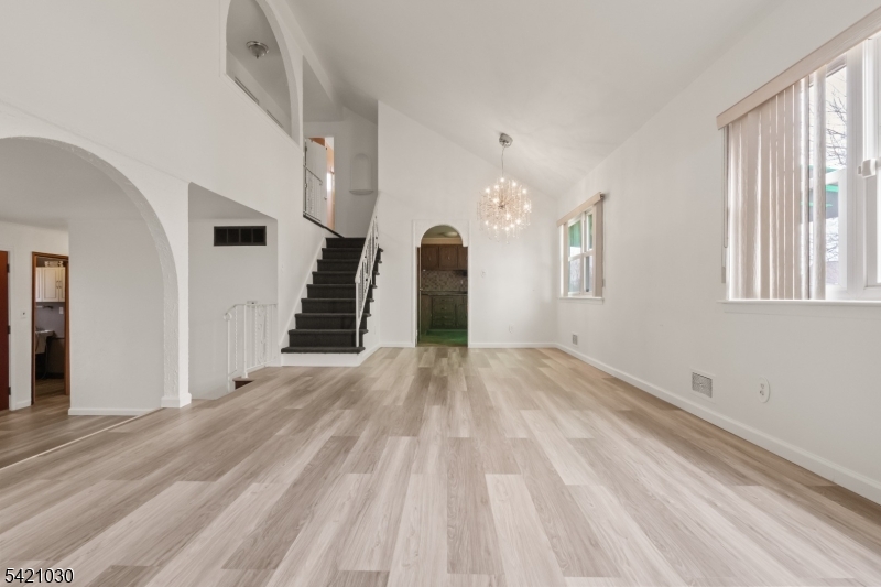 838 Florida Grove Road Perth Amboy, NJ 08861 - Photo 5 of 13 a view of a room with stairs and a window