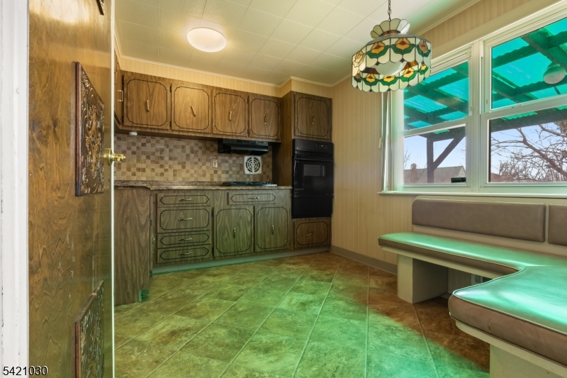 838 Florida Grove Road Perth Amboy, NJ 08861 - Photo 6 of 13 a bathroom with a sink a mirror and a shower