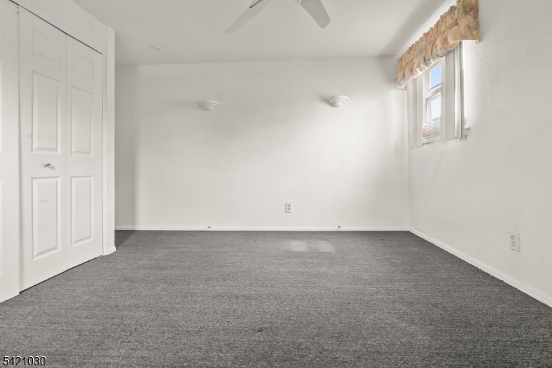 838 Florida Grove Road Perth Amboy, NJ 08861 - Photo 9 of 13 an empty room with windows