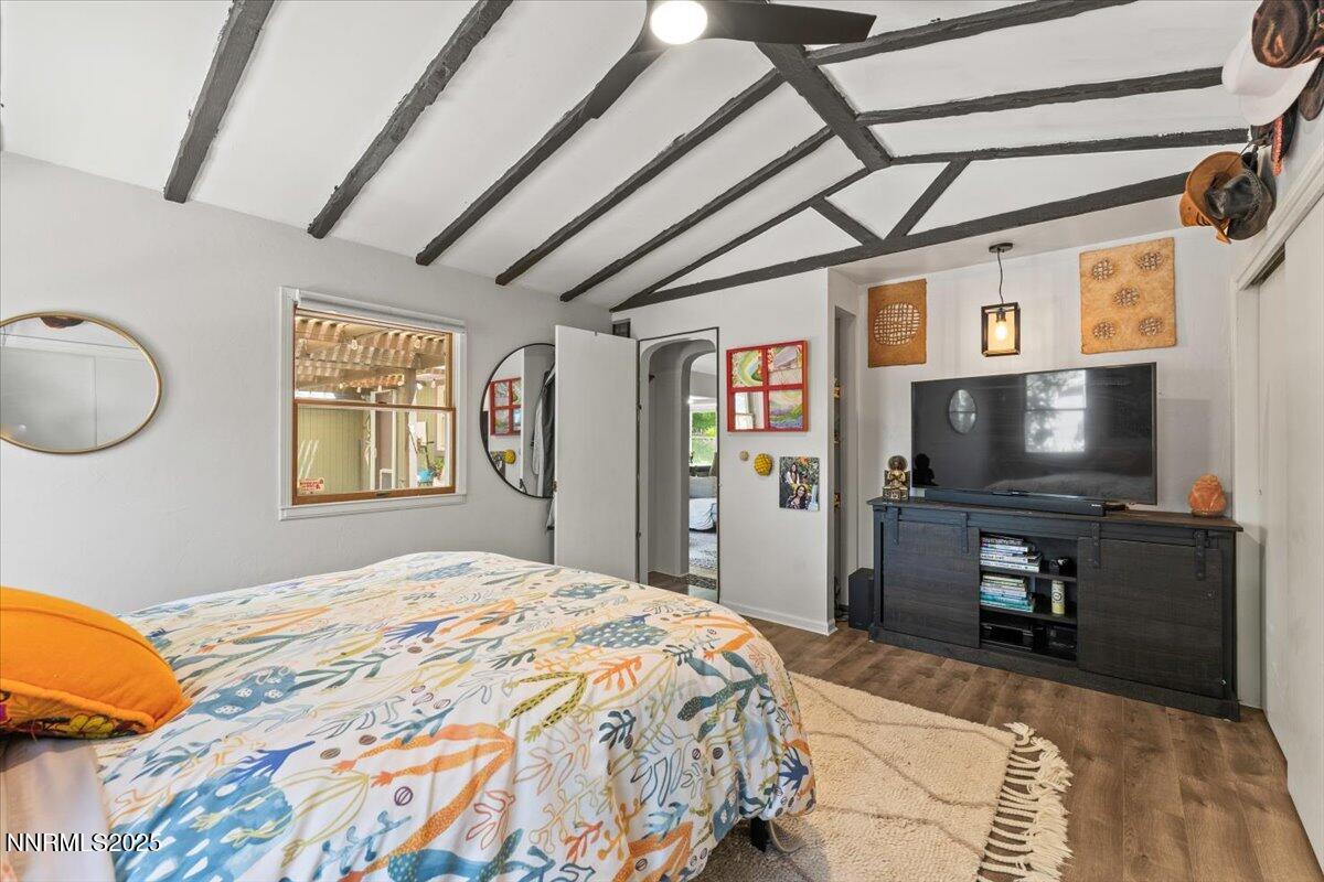 661 Thoma Street Reno, NV 89502 - Photo 14 of 33 a bedroom with a bed and a flat screen tv