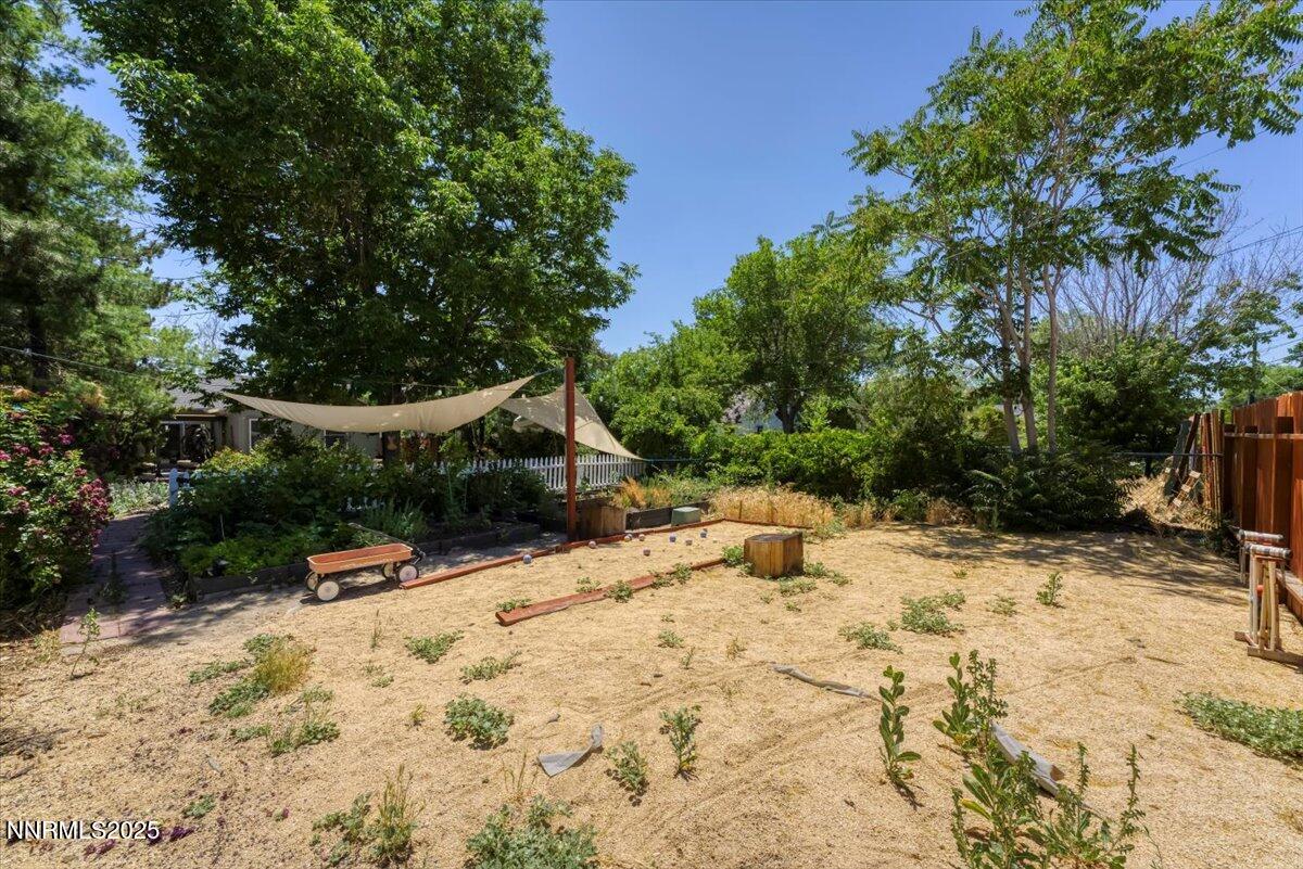 661 Thoma Street Reno, NV 89502 - Photo 31 of 33 a view of a yard covered in snow
