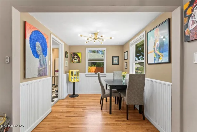 a view of a dining room with furniture window and wooden floor