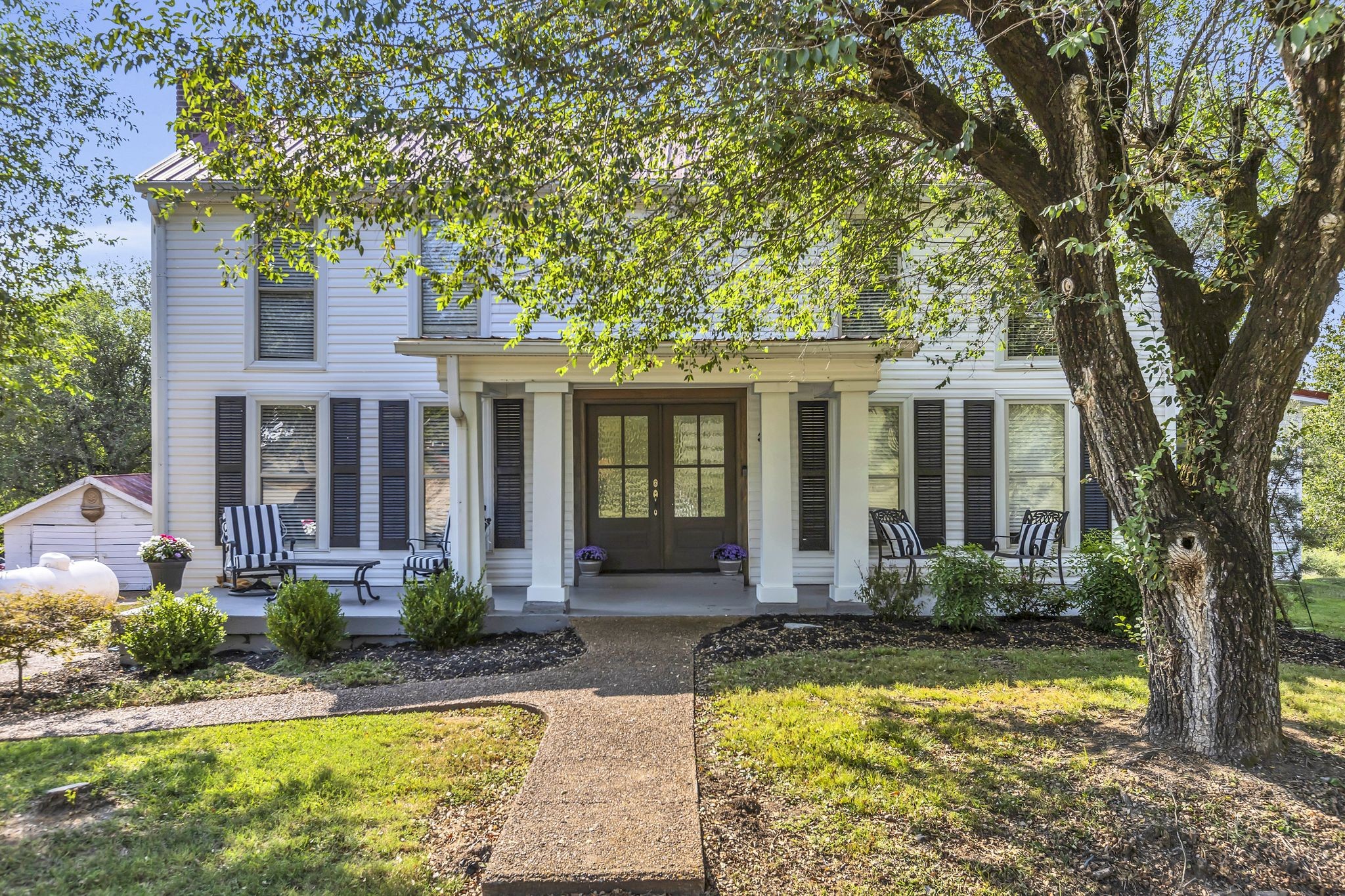 3798 McCandless Road Columbia, TN 38401 - Photo 1 of 28 a front view of a house with swimming pool and porch