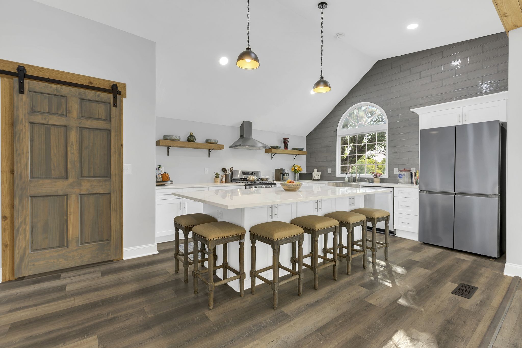 3798 McCandless Road Columbia, TN 38401 - Photo 6 of 28 a kitchen with stainless steel appliances granite countertop a dining table chairs and granite counter tops