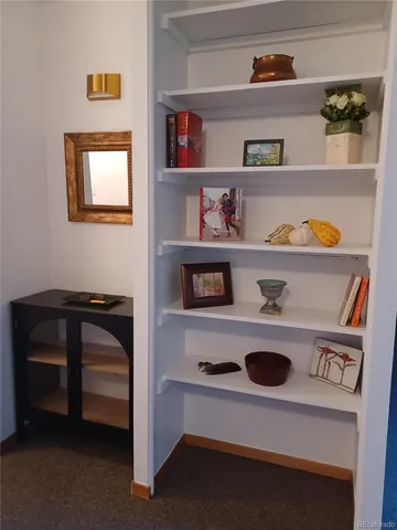 a room with a refrigerator and a more cabinets