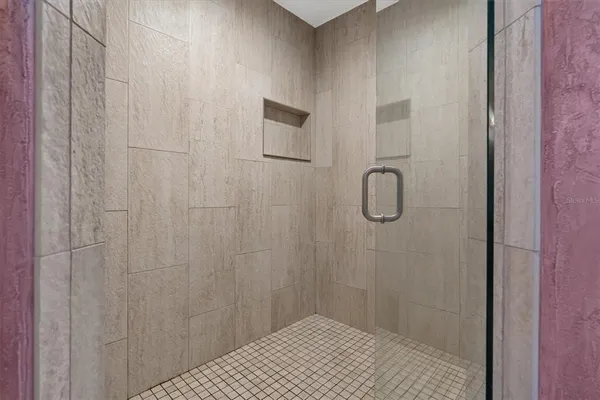 a view of a bathroom with washing machine and a sink