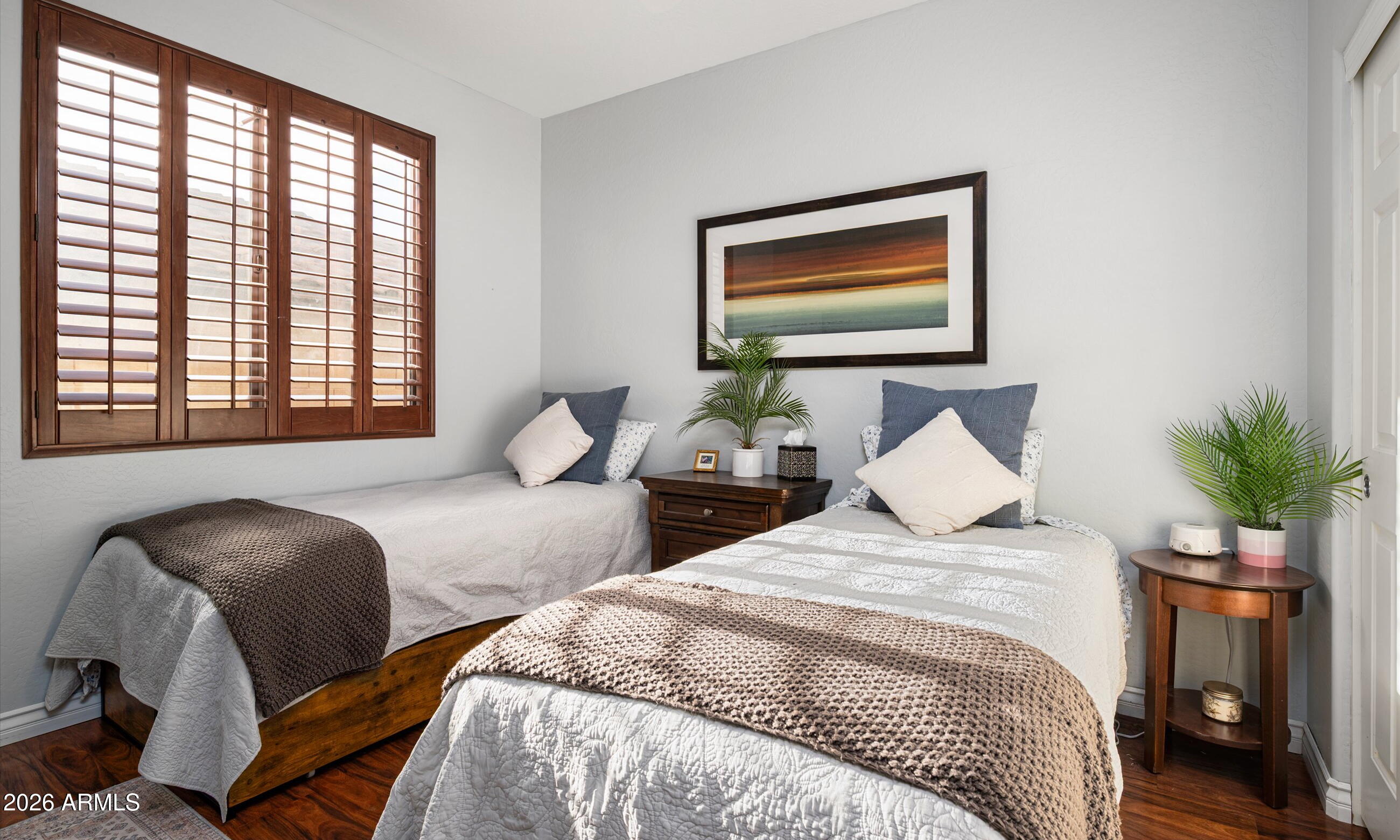 2021 West Steed Ridge Phoenix, AZ 85085 - Photo 14 of 56 a bedroom with two beds and a potted plant