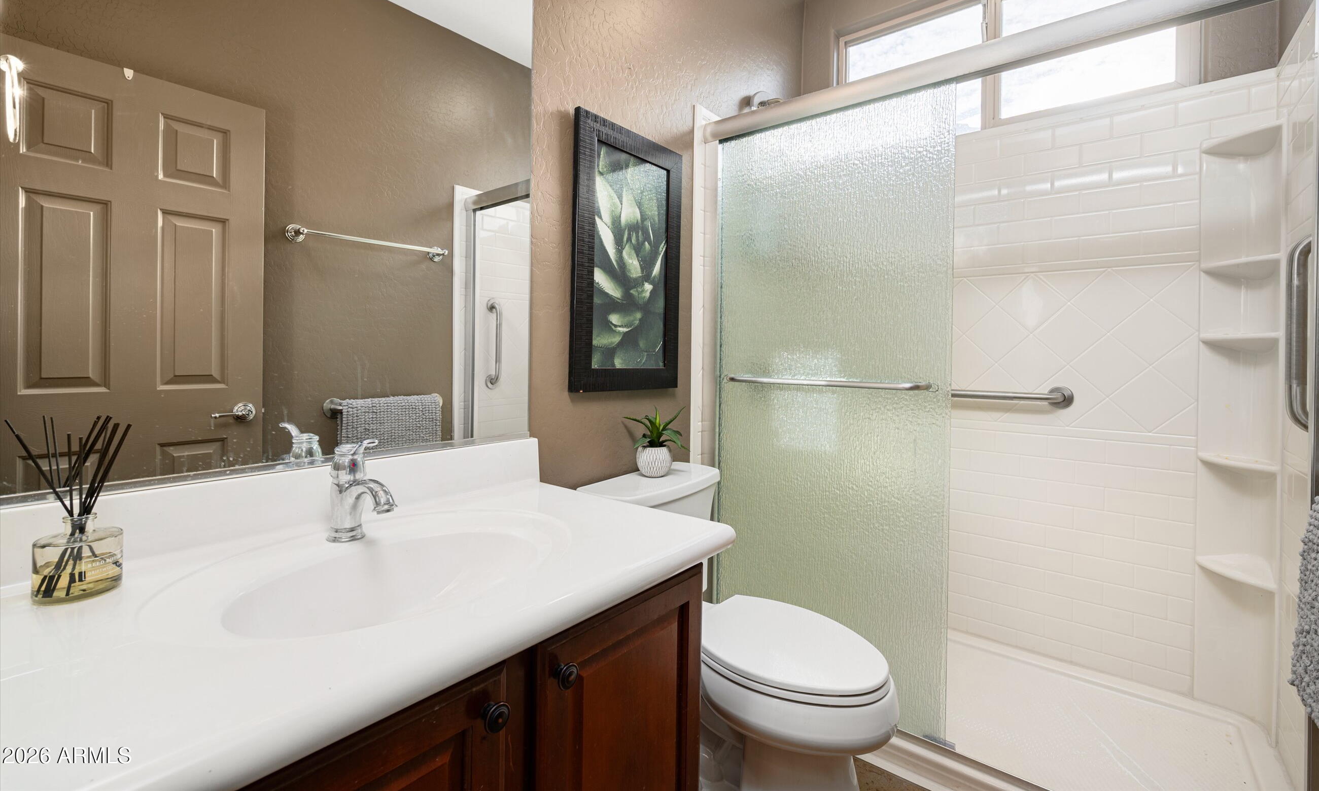 2021 West Steed Ridge Phoenix, AZ 85085 - Photo 15 of 56 a bathroom with a sink toilet and shower