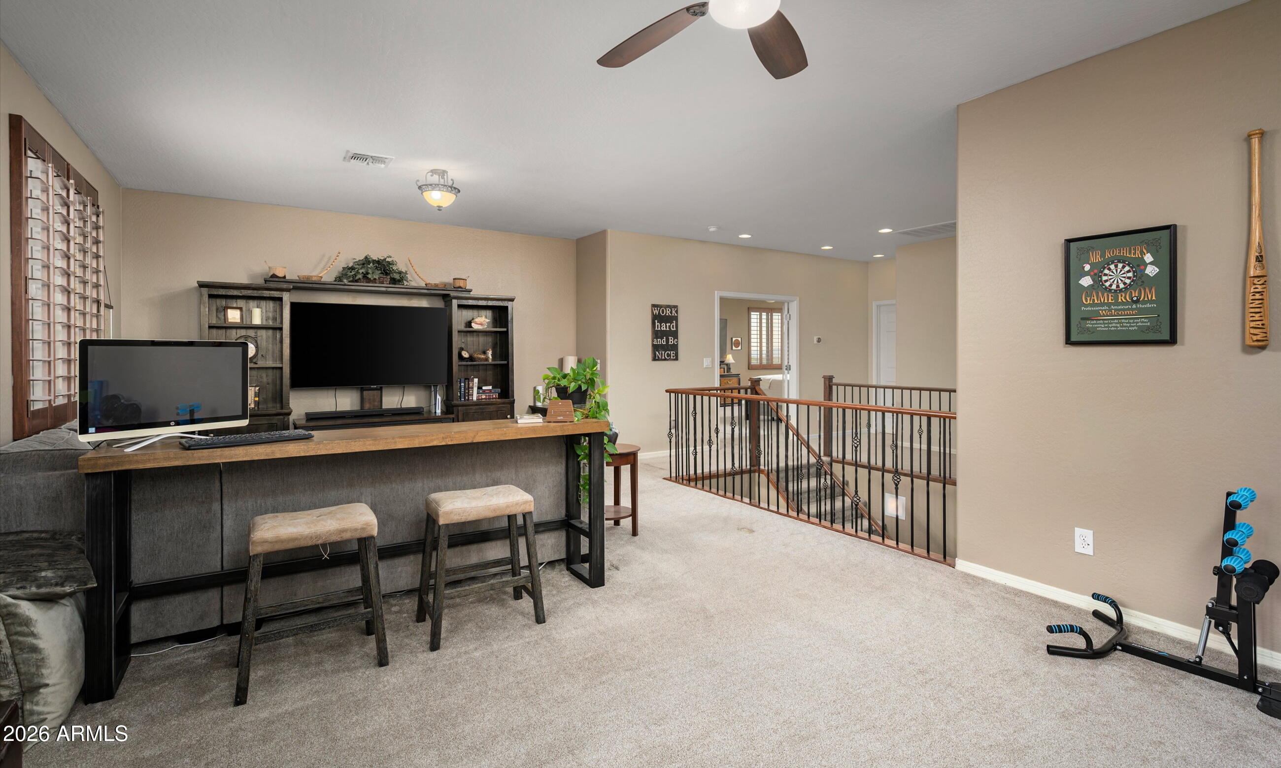 2021 West Steed Ridge Phoenix, AZ 85085 - Photo 19 of 56 a living room with furniture and a flat screen tv