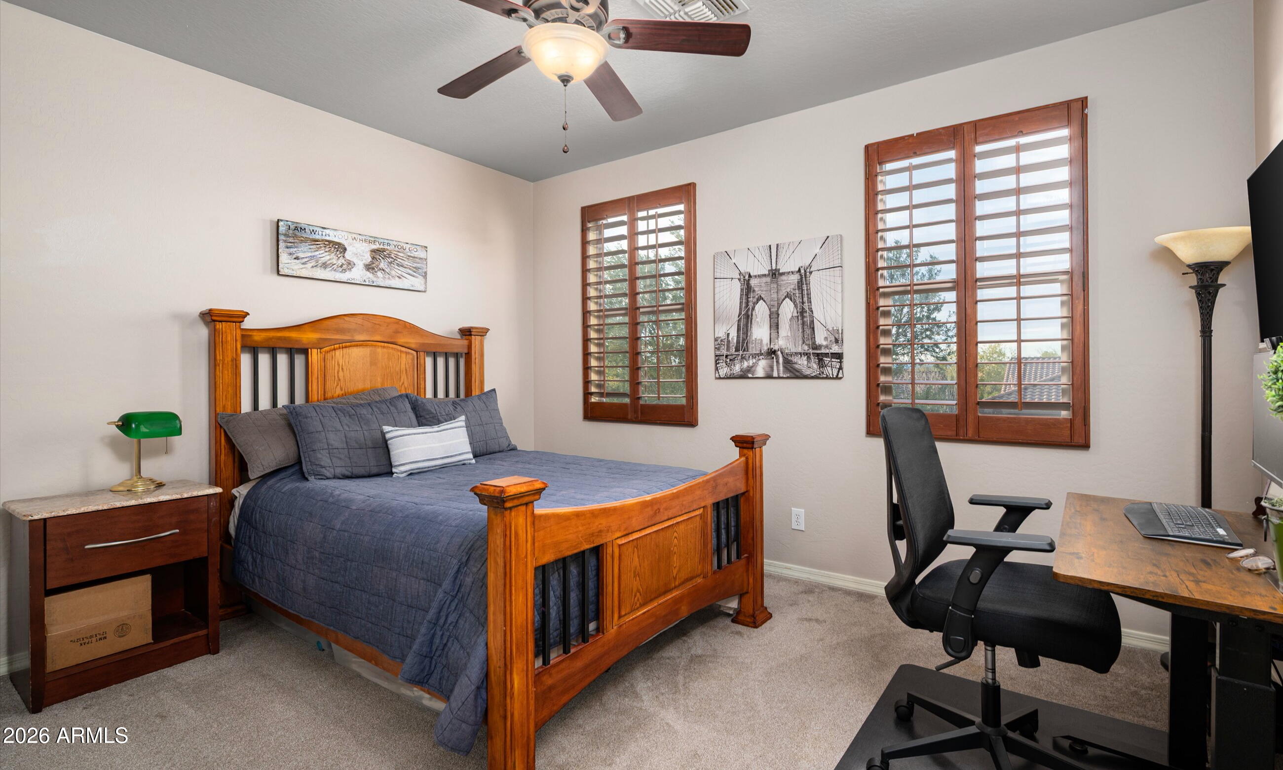 2021 West Steed Ridge Phoenix, AZ 85085 - Photo 29 of 56 a bedroom with a bed and a desk