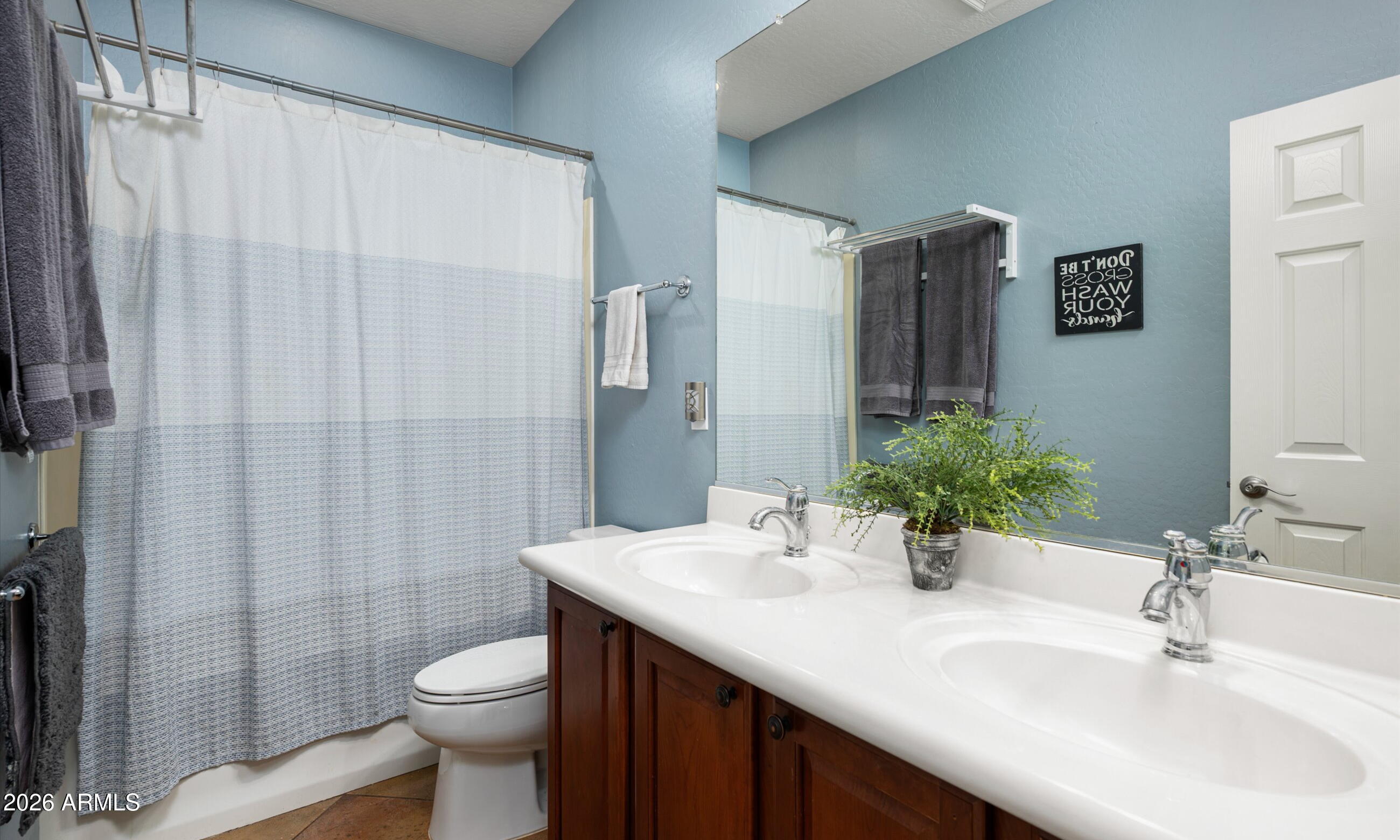 2021 West Steed Ridge Phoenix, AZ 85085 - Photo 31 of 56 a bathroom with a sink toilet and shower