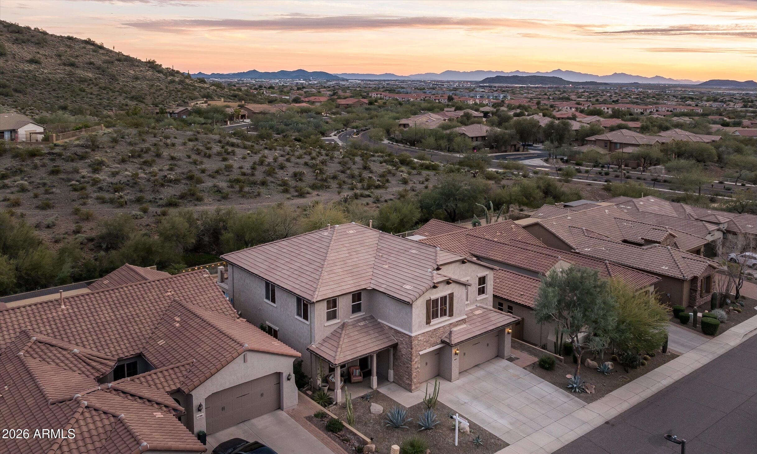 2021 West Steed Ridge Phoenix, AZ 85085 - Photo 42 of 56 an aerial view of a house with a mountain
