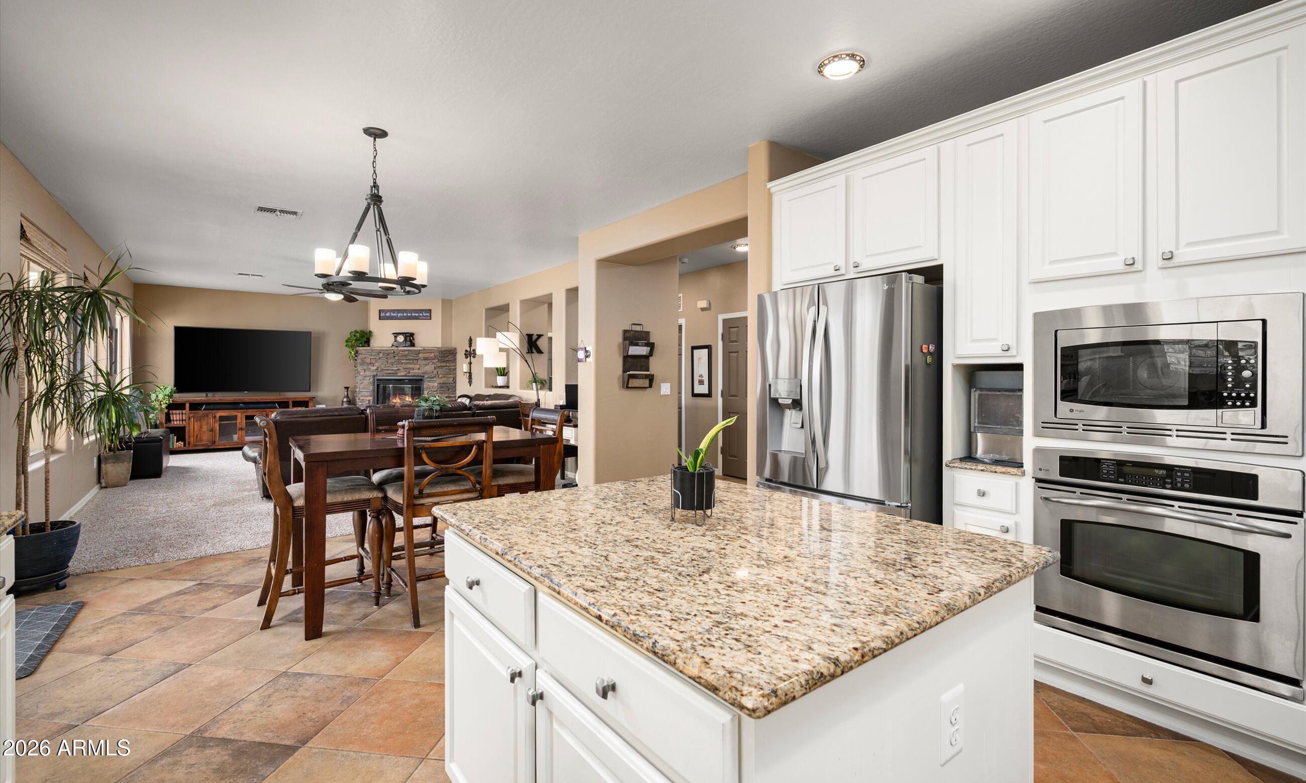 2021 West Steed Ridge Phoenix, AZ 85085 - Photo 7 of 56 a kitchen with stainless steel appliances granite countertop a stove oven and a refrigerator