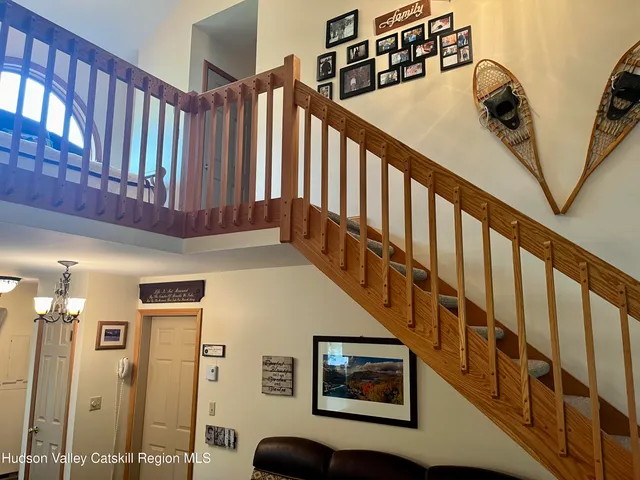 an aerial view of a house with yard and outdoor seating
