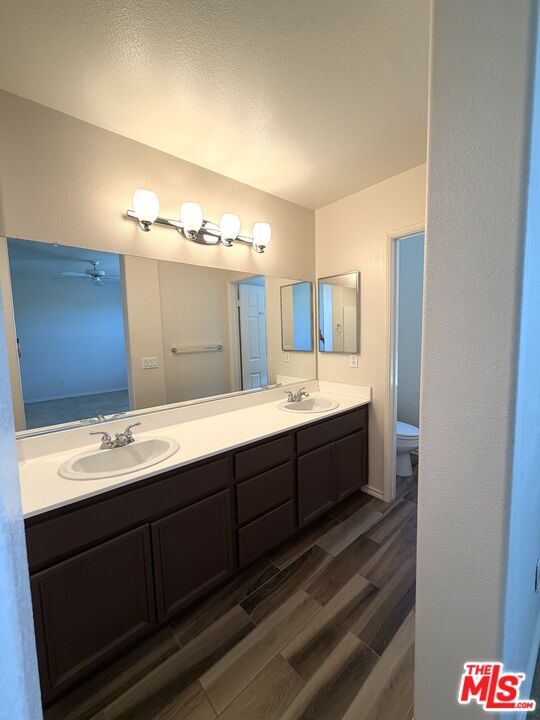 27030 Victoria Lane, Unit 76 Valencia, CA 91355 - Photo 13 of 19 a spacious bathroom with a double vanity sink and a mirror