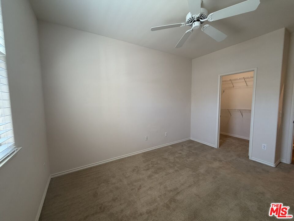 27030 Victoria Lane, Unit 76 Valencia, CA 91355 - Photo 15 of 19 an empty room with windows and fan