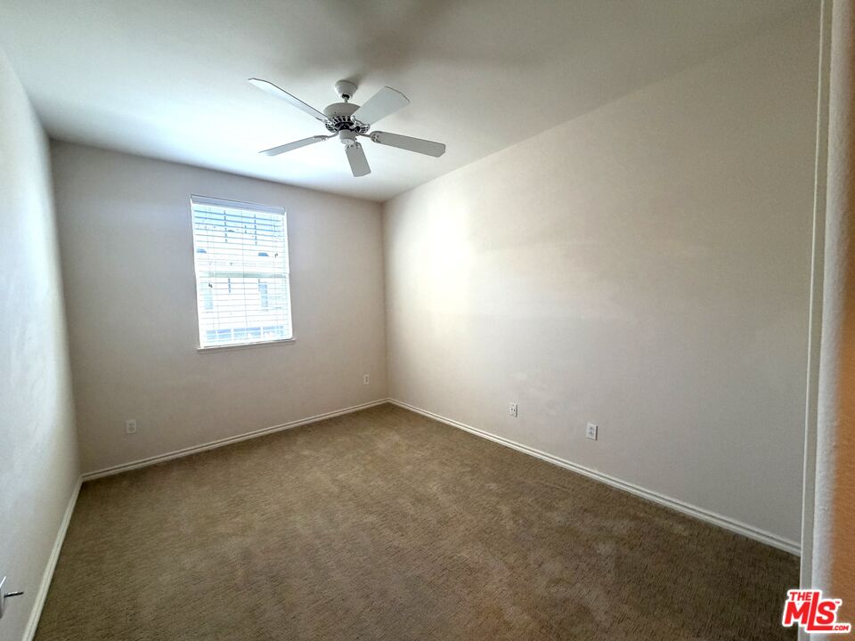 27030 Victoria Lane, Unit 76 Valencia, CA 91355 - Photo 16 of 19 an empty room with windows and fan