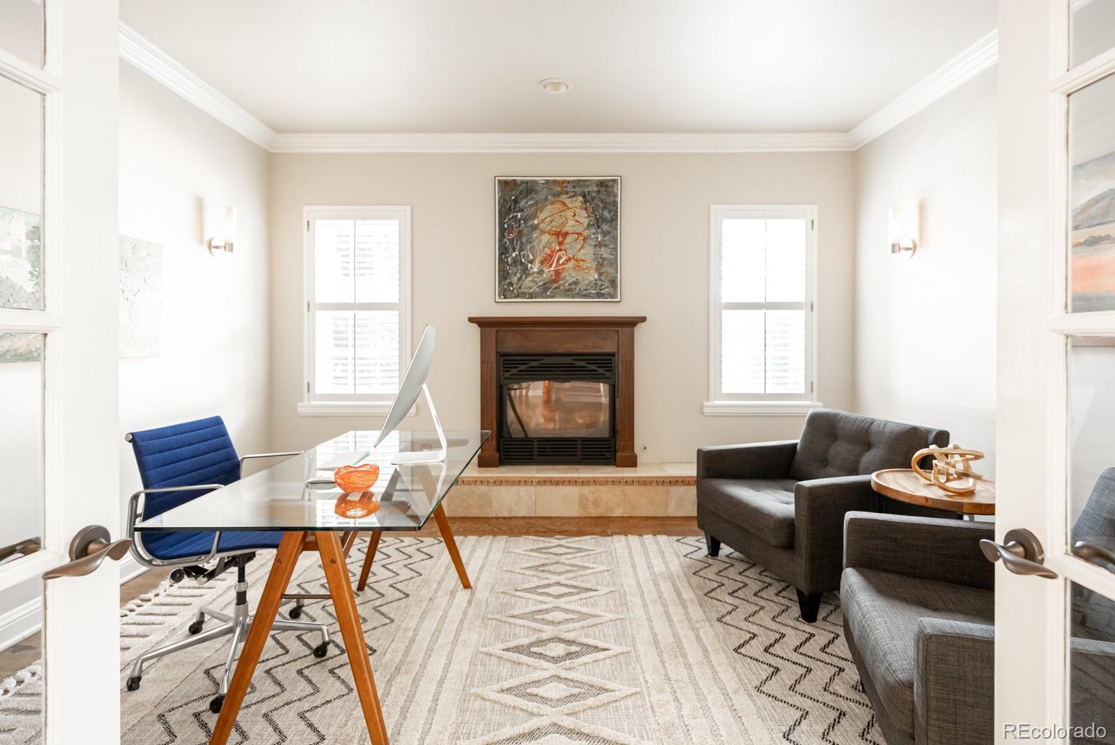 3350 Oak Street Wheat Ridge, CO 80033 - Photo 15 of 40 a living room with furniture and a fireplace
