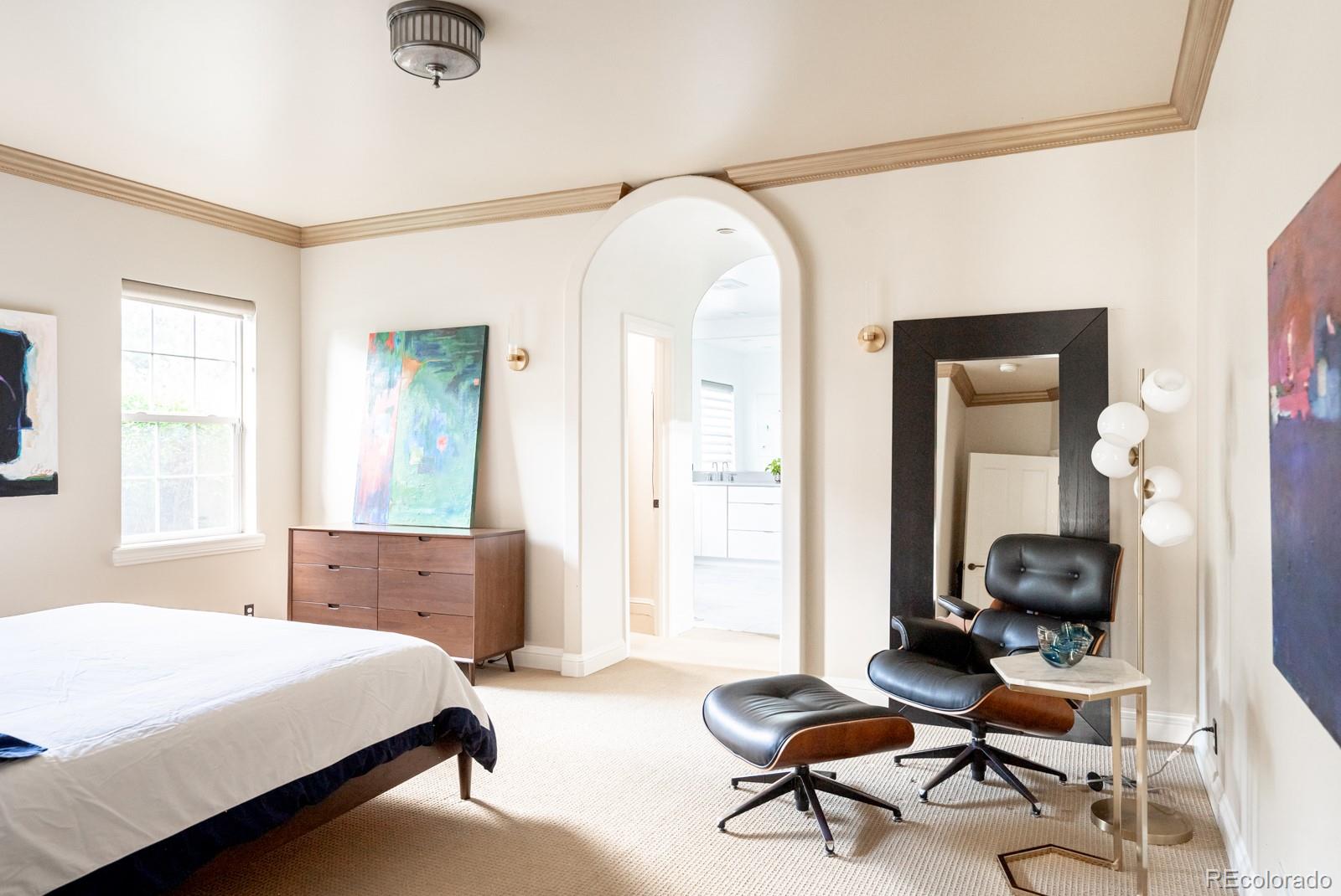 3350 Oak Street Wheat Ridge, CO 80033 - Photo 17 of 40 a bedroom with a bed and large windows