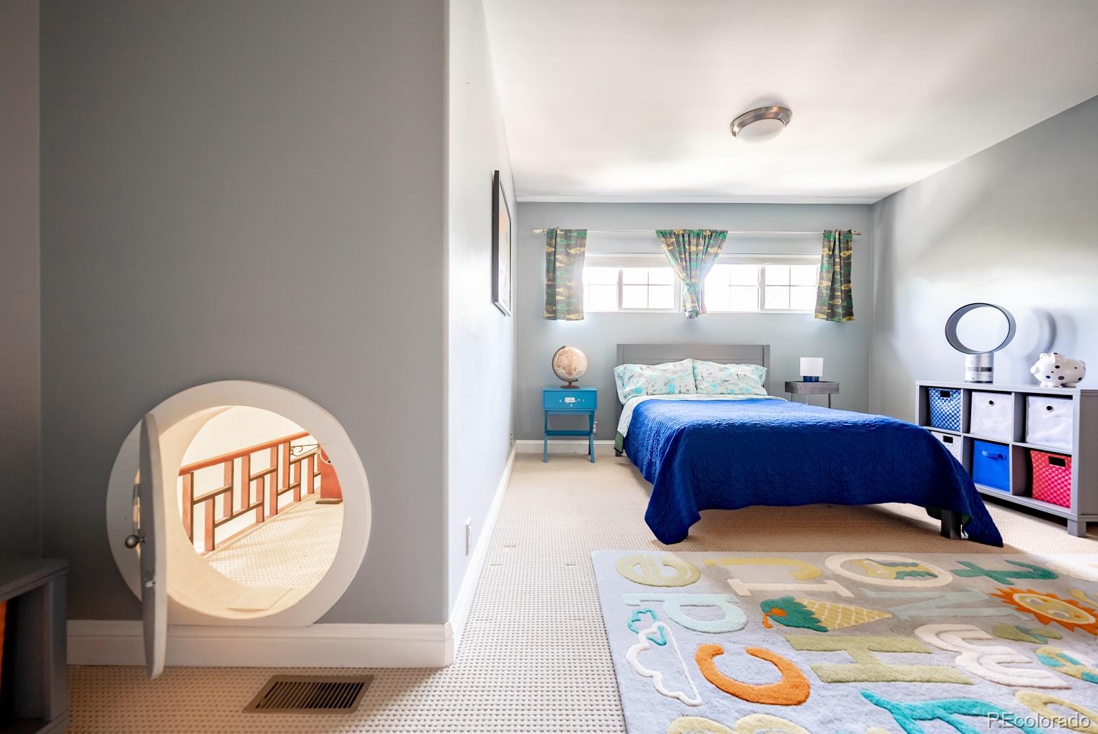3350 Oak Street Wheat Ridge, CO 80033 - Photo 24 of 40 a bedroom with bed and a window