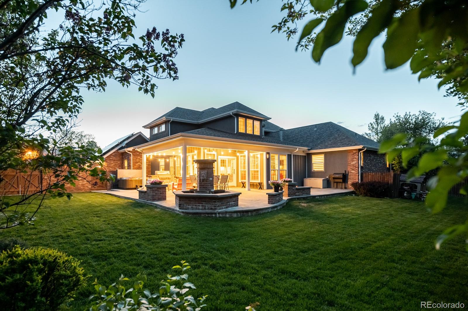 3350 Oak Street Wheat Ridge, CO 80033 - Photo 36 of 40 a front view of a house with a garden