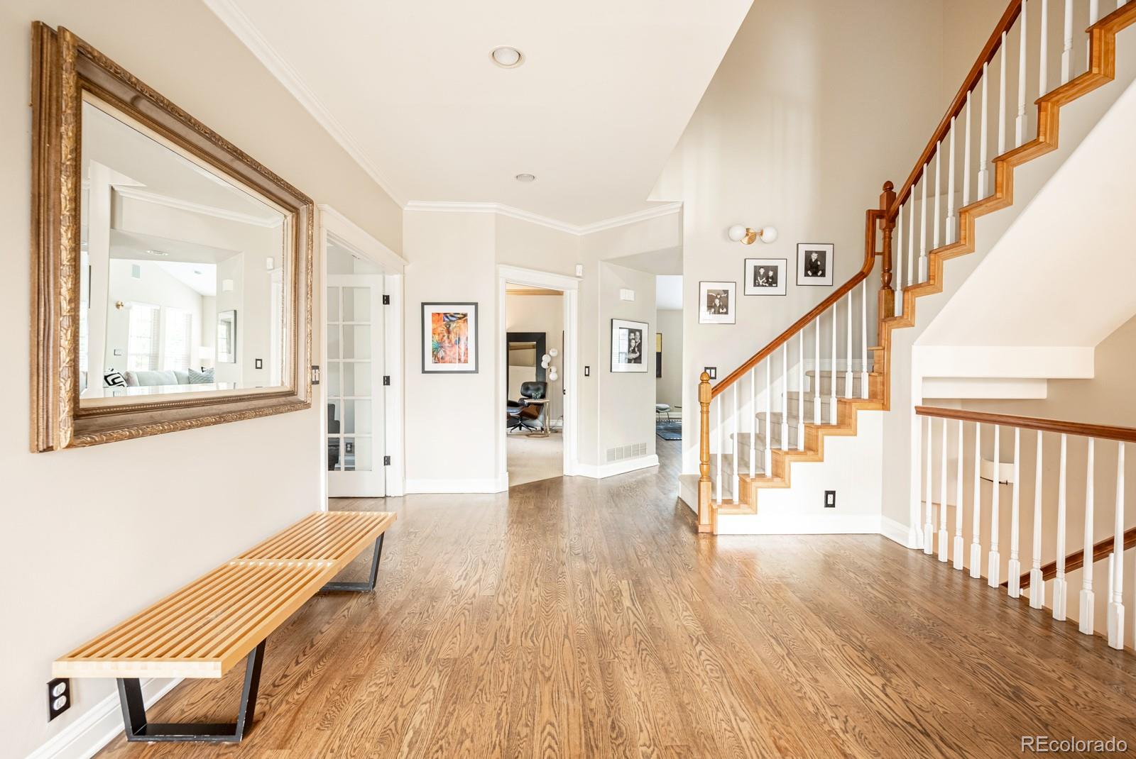 3350 Oak Street Wheat Ridge, CO 80033 - Photo 7 of 40 a view of a livingroom with wooden floor and stairs