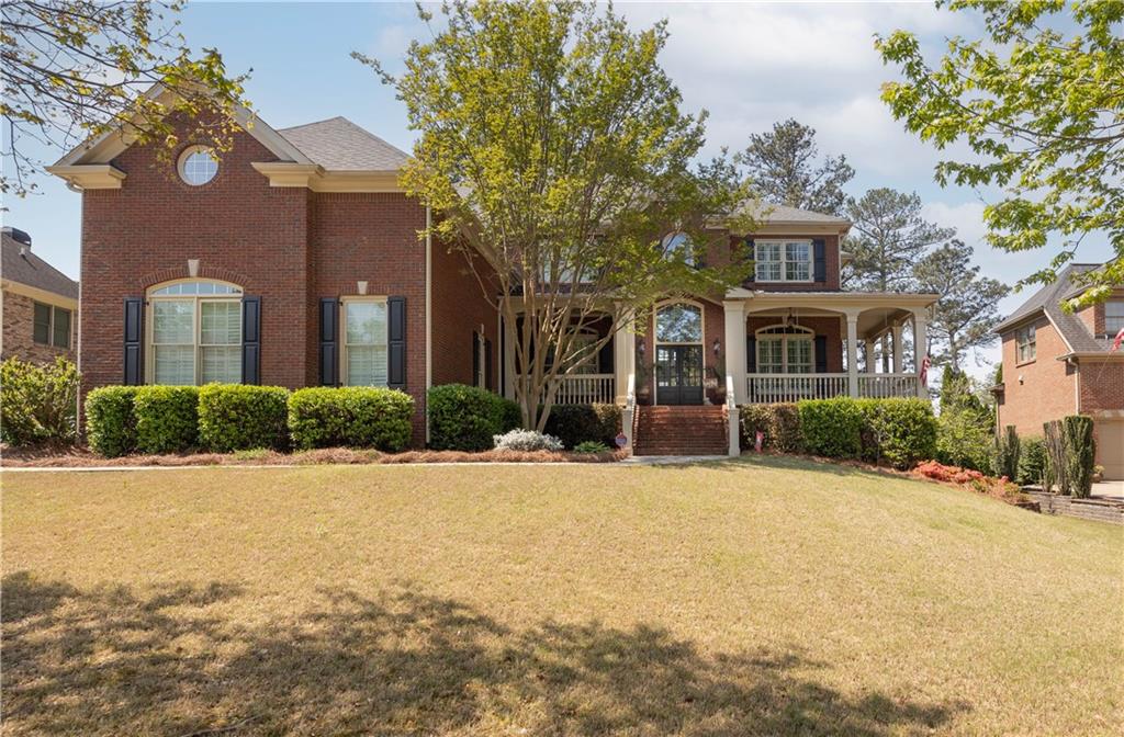 802 Pathview Court Dacula, GA 30019 - Photo 12 of 50 a front view of a house with a yard and garage