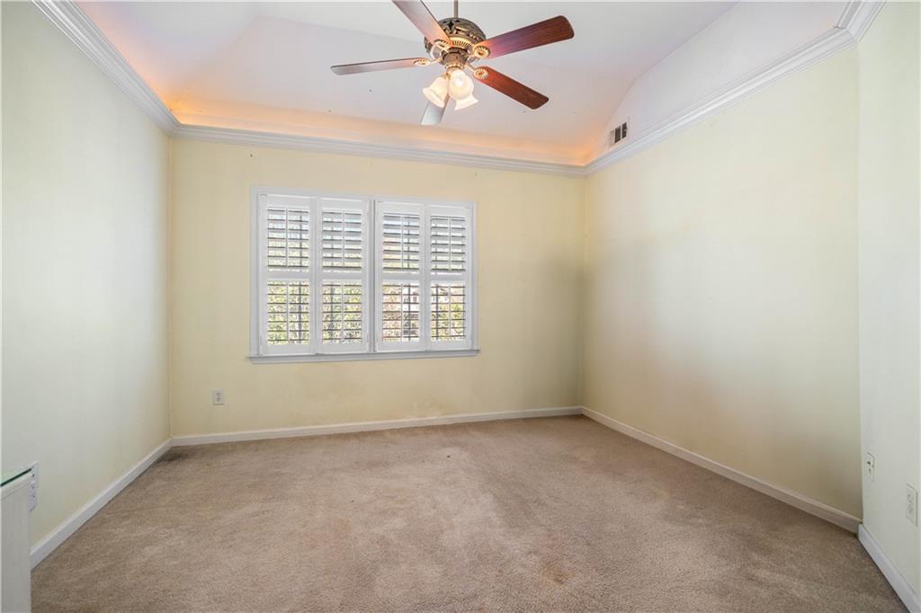 802 Pathview Court Dacula, GA 30019 - Photo 22 of 50 an empty room with a window and a fan