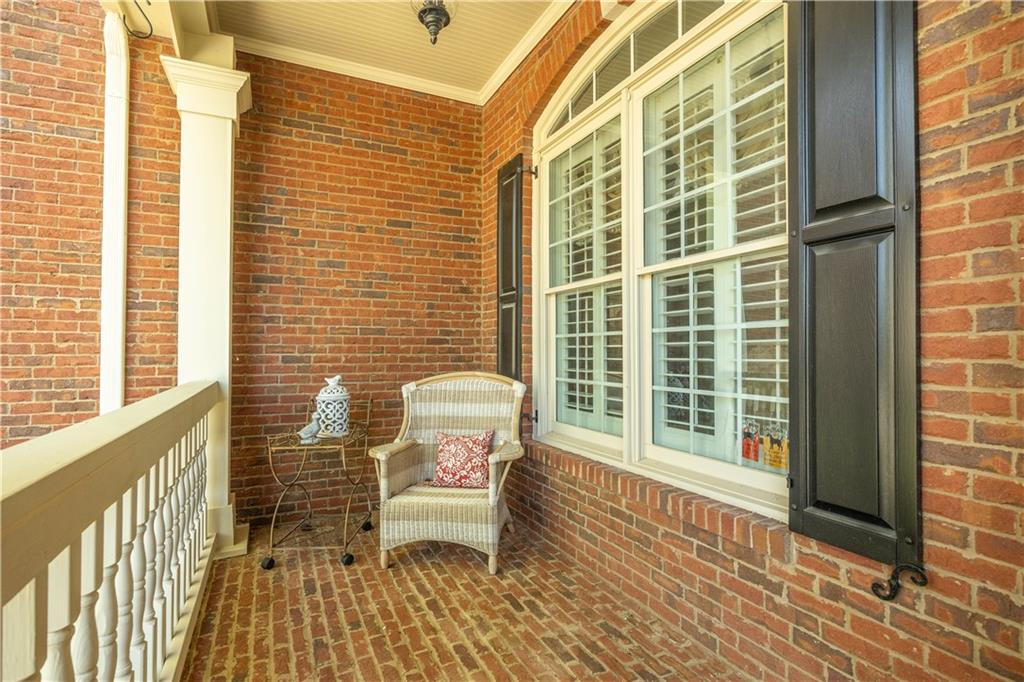 802 Pathview Court Dacula, GA 30019 - Photo 33 of 50 a view of a balcony with wooden floor and iron stairs