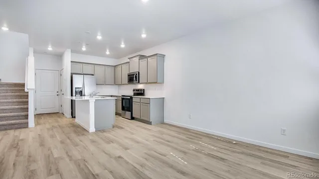 a view of kitchen with wooden floor