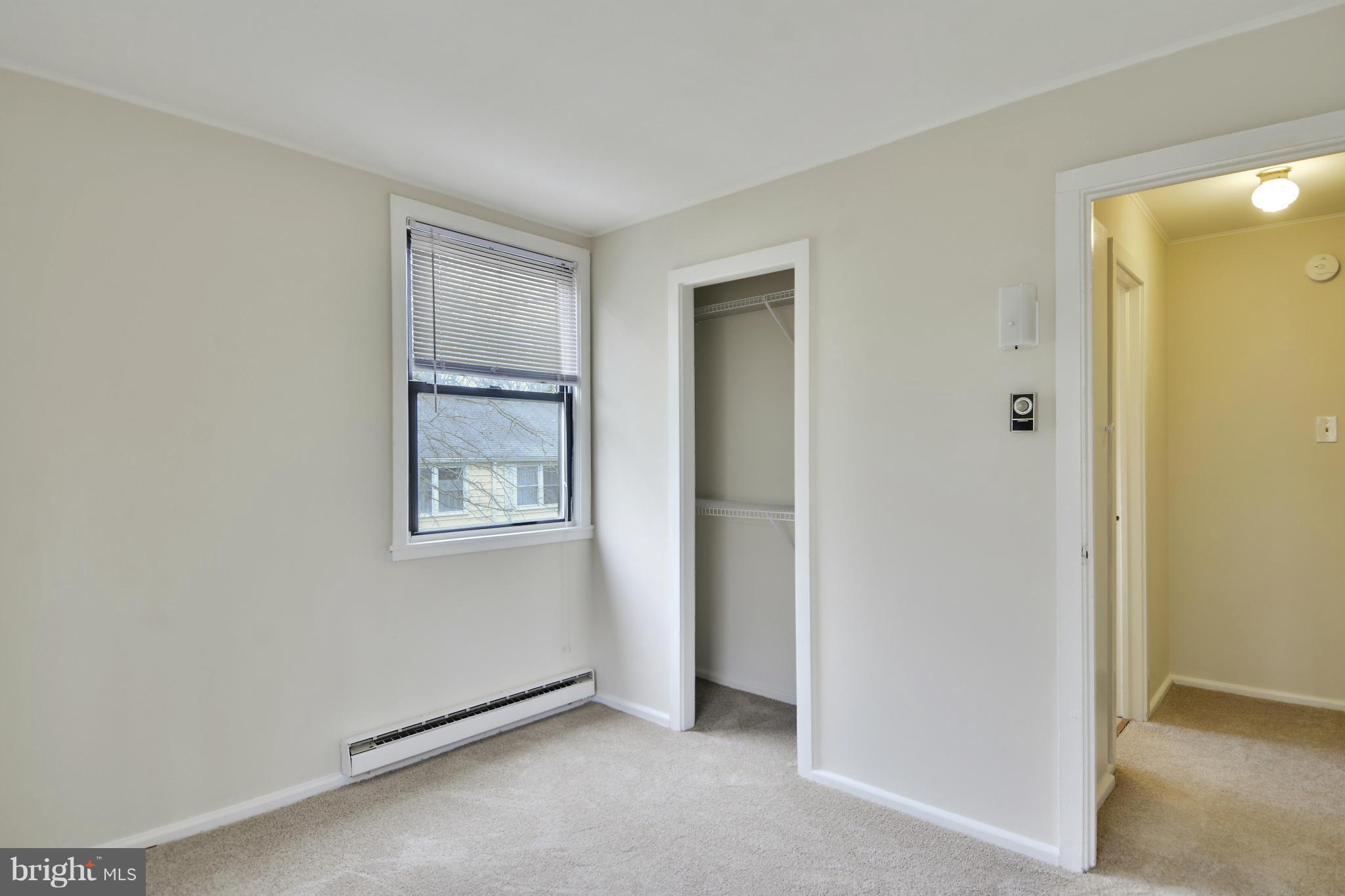 54 Ridge Road, Unit G Greenbelt, MD 20770 - Photo 12 of 30 a view of an empty room with window and closet area