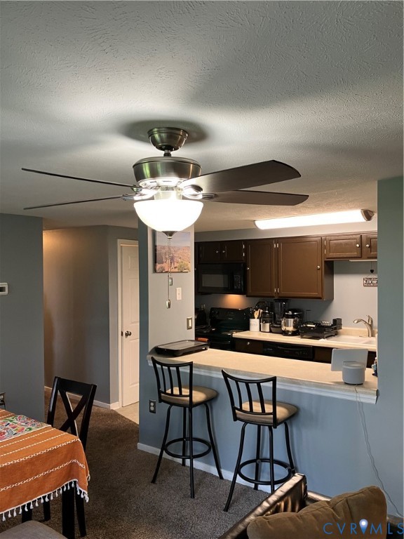 7608 Portadown Court, Unit 2602 Henrico, VA 23228 - Photo 18 of 37 a kitchen with a table and chairs in it