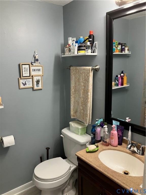7608 Portadown Court, Unit 2602 Henrico, VA 23228 - Photo 26 of 37 a bathroom with a sink mirror and toilet