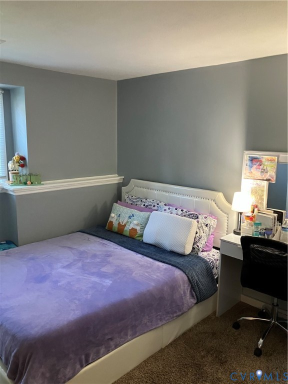 7608 Portadown Court, Unit 2602 Henrico, VA 23228 - Photo 28 of 37 a bedroom with a bed and a desk