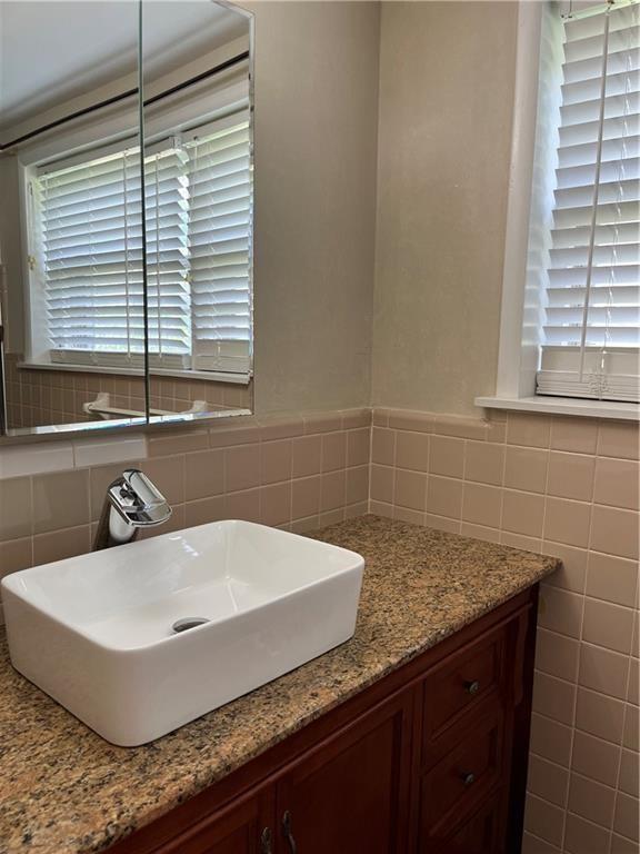 4050 Welcome All Terrace Atlanta, GA 30349 - Photo 4 of 10 a bathroom with a sink and a bathtub